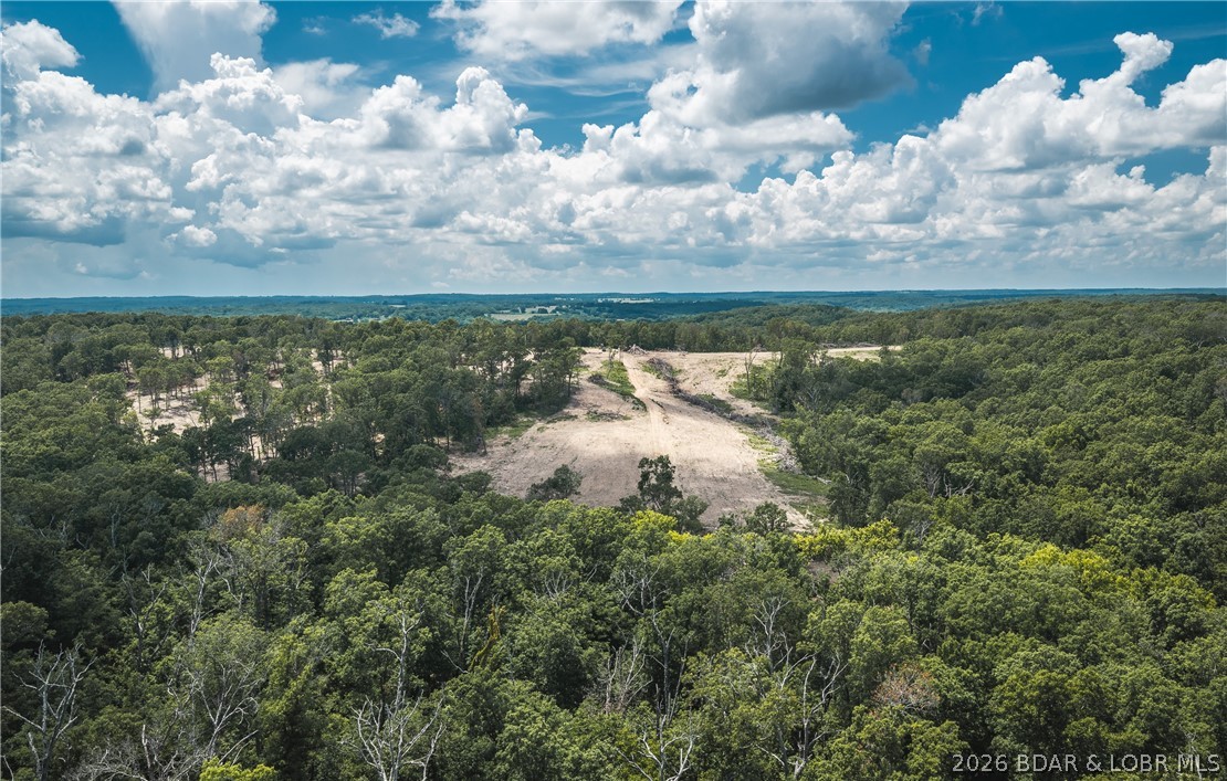 40 m/l acre tract located in Camden County. This tract has mature, old growth ,marketable timber. Great deer and turkey hunting ,several potential building spots, and a wet weather creek frontage.  Close proximity to the little Niangua creek and Lake Of the Ozarks for great fishing and recreation. An access road is being put in the center between the tracts and will have an electric access easement in place along it. More tracts available. Tracts to be surveyed. Owner will entertain selling other options.
