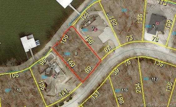 VIEW, LOCATION, DEEP WATER!!! Build your dream waterfront home on this premier deep-water lot in the highly desired Eagles Cove subdivision of Porto Cima! Situated on Grand View Drive (14 mile marker area), this 0.32-acre property boasts 100 feet of prime lake frontage, gentle topography for an easy building site, and a natural shelf rock seawall. Features an easy off-road approach with central water and sewer available at the street. Unbeatable location near the Jack Nicklaus Golf Course, Porto Cima Yacht Club, and The Club at Porto Cima, offering various membership options. Ownership includes access to Four Seasons amenities: multiple community pools, boat ramps, private fishing lakes, hiking/biking trails, tennis and basketball courts, parks, playgrounds, a dog park, and an RV/campground facility. An incredible opportunity to secure prime Lake of the Ozarks shoreline!