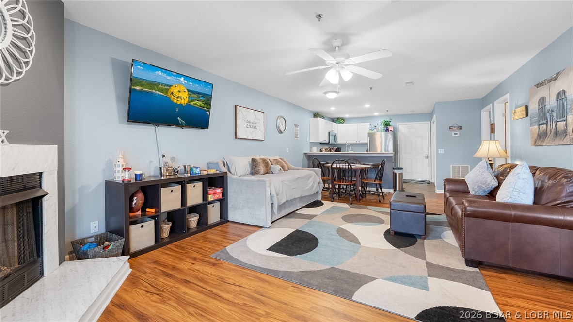 Located just outside of Camdenton in the sought-after Cedar Glen Condominiums on the Big Niangua 13MM. This beautifully maintained lower-level condo delivers an unbeatable lakefront lifestyle with incredible accessibility by both land & water! Cedar Glen is known for its exceptionally well-kept grounds, lower HOA dues compared to many lakefront complexes and outstanding amenities including multiple pools, playground, sand volleyball, boat ramp, trailer parking & more. This unit offers true walk-out access—step off your screened-in deck directly onto the lakefront boardwalk leading straight to the pools and your dock. Enjoy relaxing lake views while also being able to see the included 10x24 boat slip with brand new 7,000 lift, right from the deck! Complex has approved a 4' expansion over boat slip too, making it 10x28 under roof, if desired! Inside features updated finishes, open-concept living, stainless appliances, composite decking & comes nicely furnished, making it move-in ready for full-time living or weekend getaways.