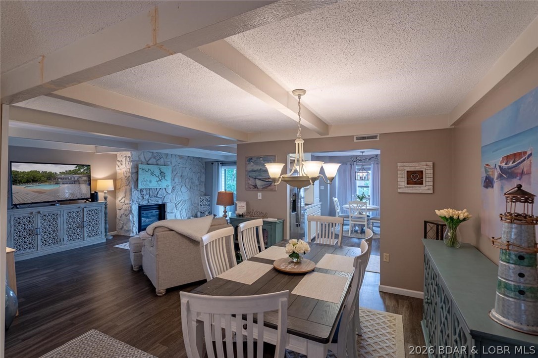 Welcome to Waters Edge Condominiums. Easy living will feel amazing in this gorgeous 3 bedroom, 3 full bathrooms & over 1800 sq ft. unit. Prepare to be wowed! This condo is spacious and updated throughout, completely turnkey with designer furniture and accessories...it is MOVE in READY!! Cozy up next to the fireplace or enjoy 3 covered balconies with lake views and true resort style amenities in one of Lake Ozark's most desirable communities. The complex offers beautiful grounds, clubhouse, community pool, tennis courts, exercise area, playground, boat ramp, & walking trails.