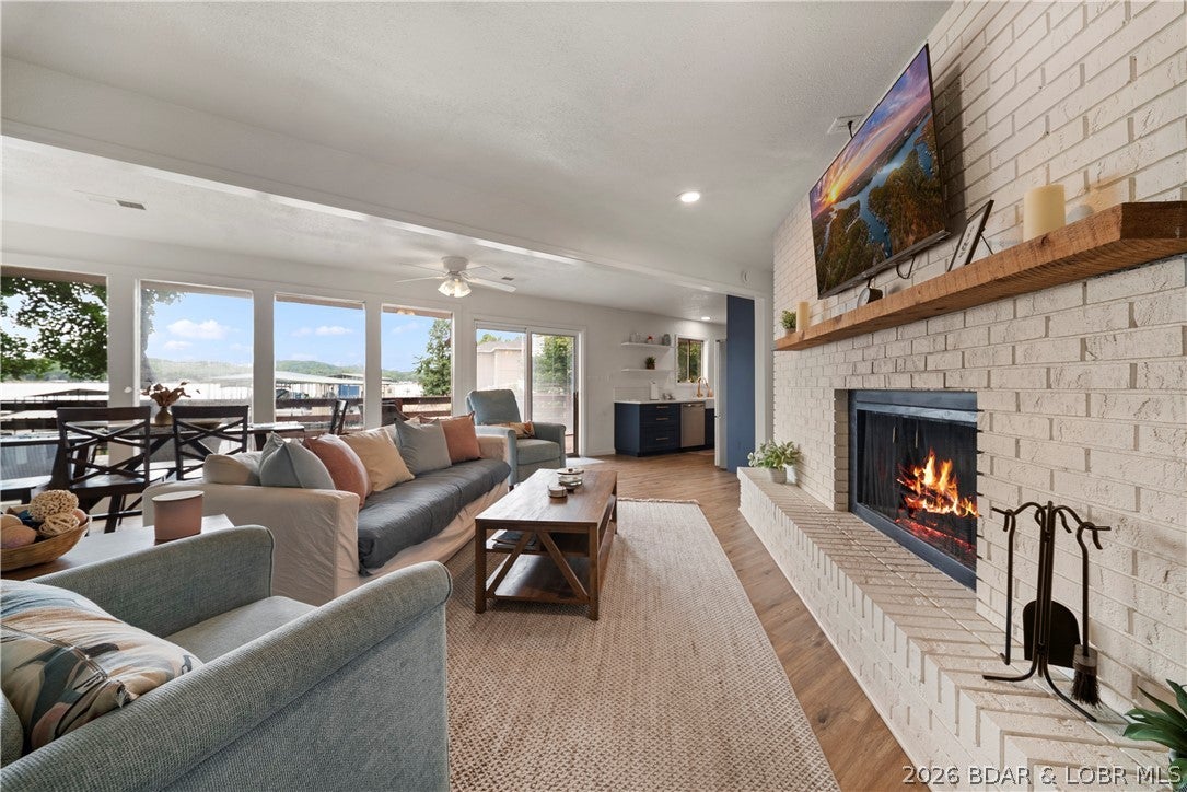Completely remodeled in 2023, this turnkey lakefront property at the 36 MM of the Osage Arm delivers modern style, panoramic sunset views, and strong rental potential. The 3BR/2BA main home features updated finishes and furnishings, an open, inviting interior, and an expansive lakeside deck with wide views of the water. A gentle walk leads to the private dock, while a private boat ramp adds convenience for launching and lake access. The detached 2-car garage includes a separate 1BR/1BA apartment, creating valuable space for guests, owner use, or additional rental income. Located in a protected cove, enjoy calmer water for swimming, kayaking, paddleboarding, and excellent bass fishing right from the dock, with quick access to the main channel. Popular waterfront restaurants are just minutes away by boat or car. With 4 bedrooms, 3 baths, multiple living options, and a prime lakefront setting, this property is ready for personal use, vacation rentals, or both.