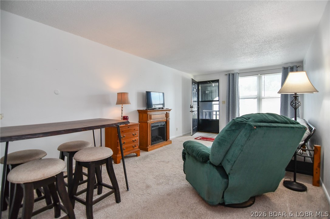 MOTIVATED SELLER!!! Location, Location, Location! This MOVE-IN ready 1 bedroom/1 bathroom condo is located in the heart of Osage Beach and comes FULLY FURNISHED, ready for you!  You can even see the lake from your front door! It sits on the top floor, so no need to worry about noise from neighbors above you and only one flight up! Enjoy convenient, easy access to the community pool next to the condo building. Lake Osage is a small complex that offers plenty of parking, community pool, and the outdoor patio deck at pool has an amazing view of the Osage 19MM.  Location by land doesn't get much better because you're close to entertainment, grocery stores, top notch restaurants, close to schools, the hospital, state parks, etc. Laundry is located in same building through a secured door for your convenience and safety. Storage locker #216 included. Great for full time living or a weekend get-away, or make this the best investment in your portfolio! Take a look at this great condo and you will love everything it has to offer! *Seller is offering $2,500 for carpet allowance or upgrades*
