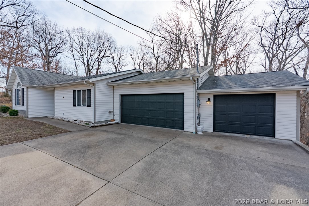 Discover the perfect combination of modern updates and lake-area living with this beautifully refreshed 3BR, 2BA home in Lake Ozark. Thoughtfully renovated with fresh interior and exterior paint, new appliances, upgraded countertops, stylish lighting, and brand-new flooring throughout, this home offers a clean, contemporary feel from the moment you step inside. 

The spacious 3-CAR GARAGE provides plenty of room for vehicles, storage, or all your lake toys, while the large backyard offers space to relax, entertain, or create your own outdoor retreat. Curb appeal shines, making every arrival feel like home.

Even better, you’ll enjoy a 10x20 BOAT SLIP in a community dock on the popular 8MM, placing you in the heart of the action on Lake of the Ozarks.

Conveniently located near dining, shopping, and entertainment, this property is ideal as a full-time residence, vacation getaway, or investment opportunity. Enjoy the lake lifestyle with comfort, convenience, and style all in one place.