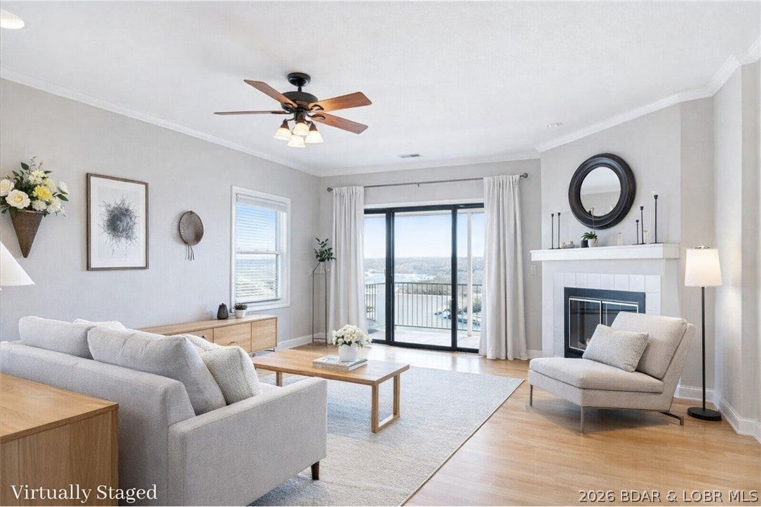 Experience effortless lake living in this beautifully maintained 3-bed, 2-bath condo overlooking the Big Niangua Arm at the 9-MM. Offered fully furnished & move-in ready, this property includes a 10'x24' boat slip with a 10,000-lb HydroHoist, private garage, & additional storage—perfect for a full-time residence or weekend getaway. With only eight steps from the parking area to the front door, convenience begins the moment you arrive. Inside, you’ll love the open-concept living floor plan featuring vinyl plank flooring, corian countertops, panoramic lake views, & a seamless flow for relaxing or entertaining. The spacious primary suite offers a walk-in closet & private ensuite bath, while two additional bedrooms provide plenty of room for guests, a home office, or hobbies. A full walk-in laundry room adds even more functionality. Relax on the private balcony while enjoying peaceful mornings & unforgettable sunsets over the water. Community amenities include a pool, clubhouse, workout center, hot tub, Billards, & direct dock access. Conveniently located near the Ozarks Amphitheater & just minutes from Camdenton, this condo has everything you need to start making lake memories today!