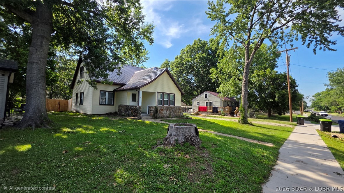 This adorable 2 bed 2 bath home is move in ready for a new family! Detached garage with workshop, second detached building for an additional man cave or she shed, private fenced in back yard, plenty of parking and within walking distance of the Courthouse, restaurants, shopping, coffee shops and more! New custom blinds, new paint in kitchen, pantry with access to basement for storage. This one will fit your Lifestyle!