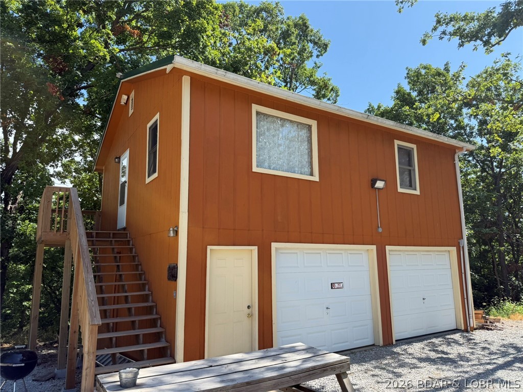 Eagles Nest is a two-bedroom cabin. Fully equipped kitchen. Located above the garage with outside stairs. Just down the road from Truman State Park Marina giving you quick and easy access to Truman Lake, while also being close to Drake Harbor where you can access the Lake of the Ozarks. This cabin has been a successful rental and has a long client list. Could be utilized as an Airbnb or long-term rental on the side.