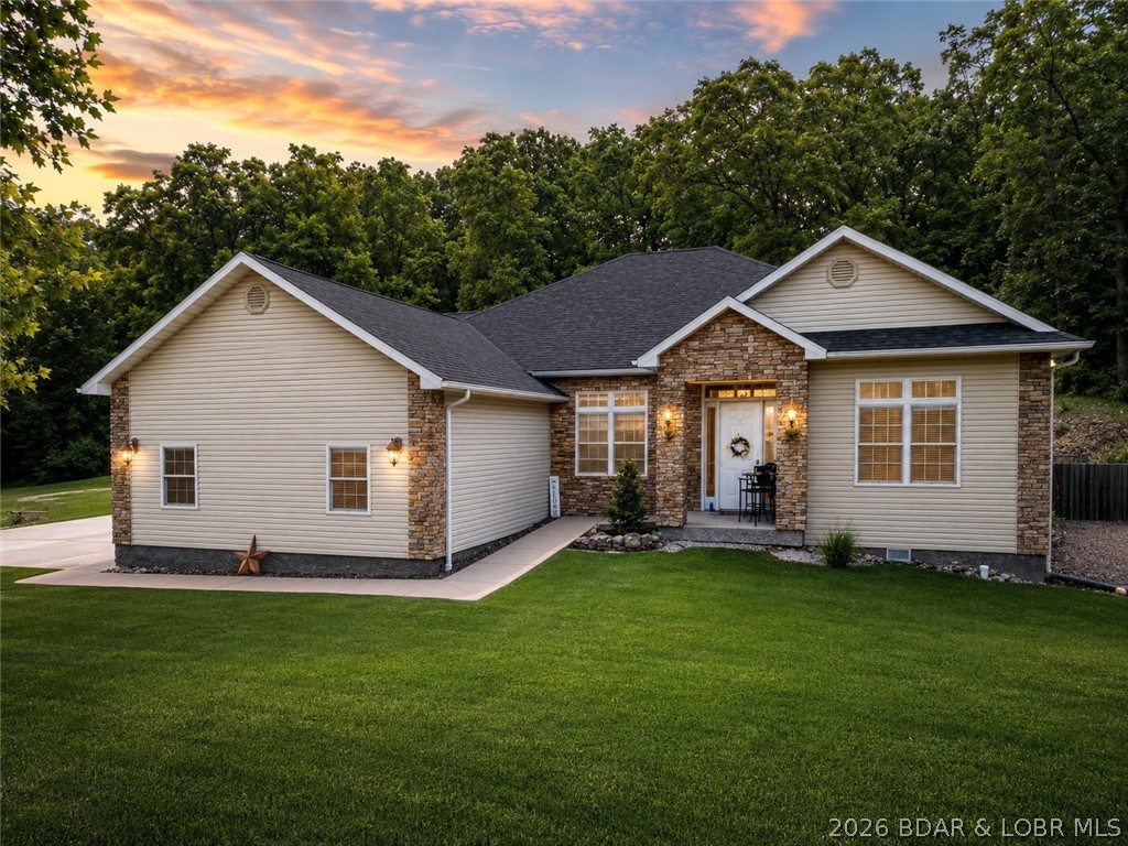 Welcome to your perfect Lake of the Ozarks retreat! This beautifully maintained 5 bedroom, 3 bathroom ranch-style home offers 3,600 square feet of comfortable living space in a peaceful neighborhood with NO HOA and a Brand new Roof. Designed with both relaxation and entertaining in mind, the spacious layout features three separate family rooms, giving everyone plenty of room to gather or unwind. The large kitchen is a true centerpiece, complete with a bar top for casual seating and a pantry for added storage. Step outside to enjoy the cozy patio—ideal for sipping your morning coffee while taking in the serene surroundings and lake views.  The home also boasts beautiful curb appeal and a storage shed for all your extra needs. Located just minutes from the Bagnell Dam Strip, you’ll have quick access to dining, shopping, and entertainment while still enjoying the quiet side of the lake. Whether you're a first-time homebuyer or looking for a family-friendly space to grow, this move-in ready home checks all the boxes. Come experience the charm this property has to offer! As an added value, Seller is offering a $2,500 closing credit to be applied toward carpet cleaning