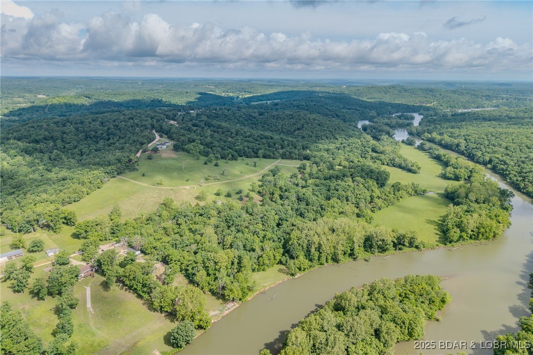 Rare opportunity to own 77 acres of riverfront land with endless potential—featuring river access, on-site electric, a well, and an established road. Ideal for building a dream home, developing an RV Park, Riverfront resort, or enjoying as a private retreat. The property offers open fields for hay production, abundant wildlife for hunting, excellent fishing, and stunning water access for recreation. With utilities in place and space to roam, this versatile acreage is ready for your vision.