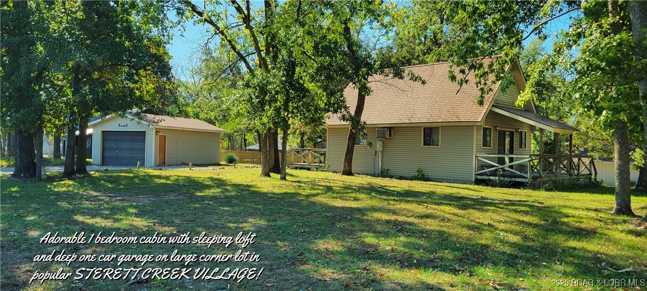 Cozy cabin on large lot with deep detached garage, located in the beautiful Truman Lake subdivision of STERETT CREEK VILLAGE! Soaring ceilings and open floorplan makes for easy lake living. Living room will hold plenty of seating for those weekend guests. Spacious dining area & breakfast bar. Plenty of cabinet space, pantry & appliances are included! Upper loft will hold several beds or would make a wonderful office area. Deep detached garage will hold a fishing boat or a vehicle with room for storage. A wrap-around porch will give you great views from all directions. Located just across the street from the swimming pool, shelter house & pickleball court. This popular subdivision boasts of lots of neighborhood events & full access to Beyonder Marina & restaurants. Just jump on your golf cart & spend the day on the lake. Just a 5 minutes drive to the beautiful, award winning lake town of Warsaw, MO. If you have always wanted a lake house, but couldn't afford it, now is your chance! At this price this one won't last!!