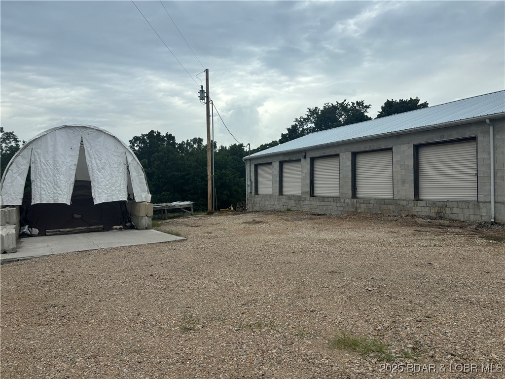 Welcome to your next investment opportunity! This unique property offers endless possibilities with warehouse and/or storage units for sale with 18 private bays with concrete block construction, on .5 acre on Hwy D. The prime location of this property makes it an ideal space for a variety of businesses or development projects. Don't have to be concerned about zoning being located in Miller county but just minutes from Osage Beach Parkway by Prewitt's Point. There is plenty of opportunity from creating your own storage areas for your items, vehicles or whatever type of products/equipment or renting out the additional units to supplement this purchase later. This is a rare location right outside the city limits of Osage Beach, located just a couple of minutes away from HyVee & Lowes right down D Road. Don't miss out on the chance to own a piece of real estate with great potential in this growing area. Call today to schedule a showing and begin envisioning the future possibilities for this incredible property.