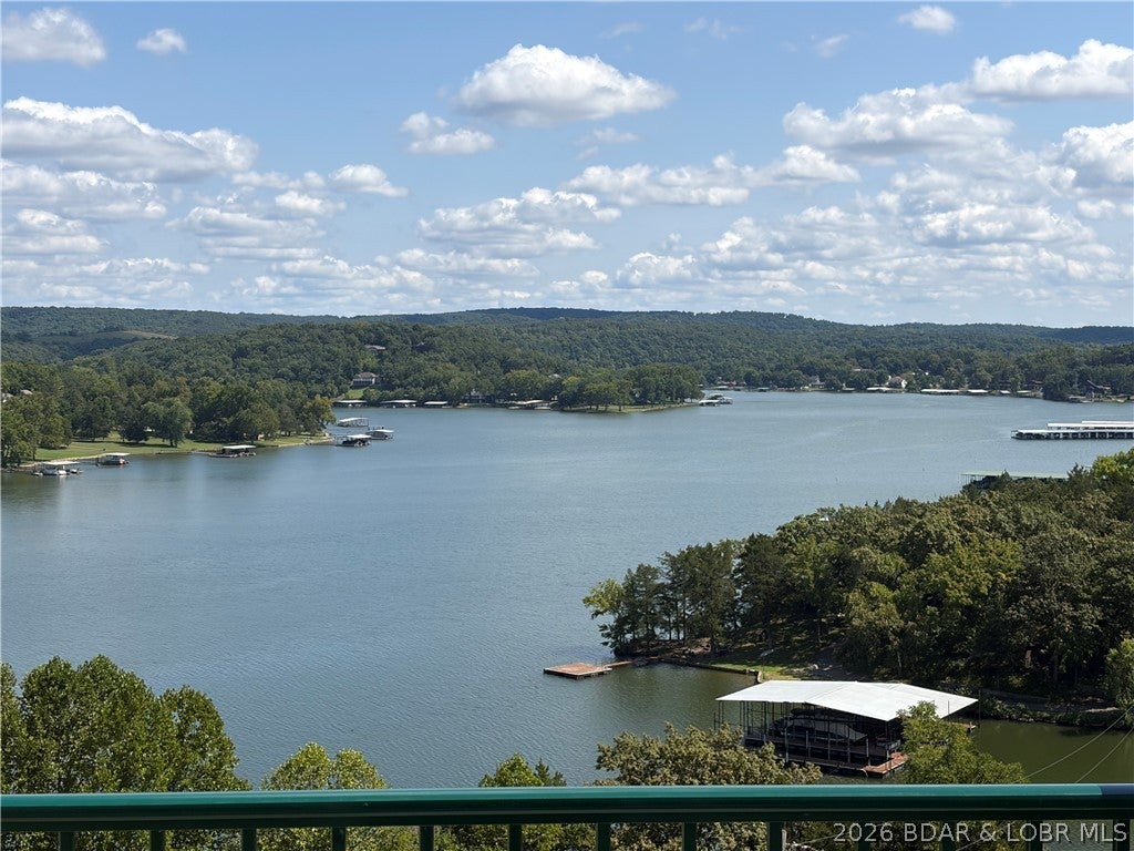 Experience luxury, convenience, and unmatched value in this pristine, TOP FLOOR end unit! FULLY FURNISHED! Vaulted ceilings and an abundance of natural light, this highly desirable 3 BR, 2 BA residence has been gently used, never rented, and kept entirely pet-free. The GATED community provides extra privacy & security.
The spacious open living room features a cozy fireplace and flows seamlessly onto a brand-new 2025 deck, offering breathtaking, PANORAMIC VIEWS of the 13 MM on the Niangua Arm. Unwind in the expansive primary suite, which steps directly onto the deck to capture those same spectacular views.
Upgrades include new decking in 2025, a new water heater in 2025, newer carpet & fresh interior paint.  Included is a 12x30 boat slip.  Turn key & ready for you to move in.
Enjoy top-tier amenities, including 3 complex pools plus an exclusive 2nd-tier pool just steps from your door. Take advantage of front-row priority parking and ample guest parking spaces.
Located minutes from Old Kinderhook, Lake Valley Golf, Ballparks National, and Ha Ha Tonka State Park, this condo offers incredible vacation rental potential or the ultimate private retreat. Schedule your showing today!