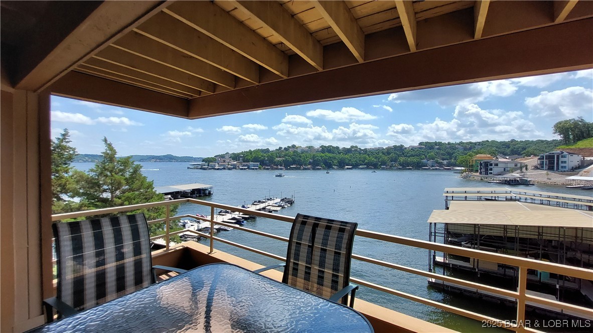Best value in The Breakers and Seller offering 1 year of HOA dues paid at closing with acceptable offer. The Breakers is a premier Horseshoe Bend community at the 3MM. This well-maintained 3-bdrm, 2.5-bath, two-level condo offers a rare combination of space, views, and premium boating accommodations. Enjoy panoramic cove and main channel views. The main floor features a spacious open-concept dining and living area with a wall of lakeside windows and full-length deck, kitchen, laundry room, half bath, and primary bdrm with en-suite. Downstairs, you'll find a second living area, two bdrms, full bath, and another full-length deck. It’s the perfect layout for entertaining and providing family or friends their own retreat. One 12' x 40' covered boat slip with boat lift included and a 10' x 24' covered boat slip ideal for jet skis/smaller watercraft may be available for additional monthly cost. Community amenities include a swimming pool, tennis/pickleball court, and clubhouse. Ideally located close to shopping, dining, and top lake destinations by both water and land, this condo delivers the full lake lifestyle experience. Owner/Broker.