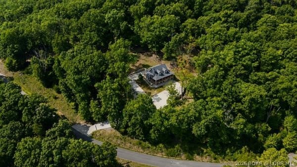 NEW CONSTRUCTION - MOVE-IN READY! New Concrete driveway with extra parking completed 2026!
This gorgeous home sits on 3.05 acres! Includes 3 additional buildable lots! Located at the 55 mile marker. Enjoy the stunning views, great fishing and abundance of wildlife! Private subdivision! COMO fiber internet, 12x32 covered boat slip located in the community dock!
Main floor living, Chef’s Kitchen, dining, living room, laundry and Primary Suite with full bath, also walks out to wrap around deck! The upper level has 2 huge bedrooms/loft, plenty of storage and space for the kids to play. The lower level has a walk-out basement, finished, huge bedroom with private full bath and much more! Home can be purchase with more land, see MLS 3589986