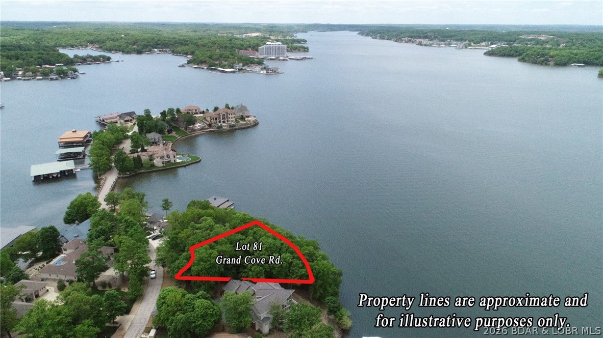 Discover the perfect setting for your dream lakefront estate in the exclusive Porto Cima community at the Lake of the Ozarks. Offering 152 feet of waterfront & gentler topography than many lakefront lots, this exceptional property provides an ideal building site with an easy transition from the road to the water’s edge. Positioned to capture stunning north & west-facing main channel views, you'll enjoy unforgettable sunsets year-round along with seasonal fireworks displays lighting up the lake. This premier homesite is located within one of the Lake’s most prestigious golf communities, home to the renowned Jack Nicklaus Signature Golf Course at Porto Cima. As you explore the property, you'll appreciate the unique combination of buildability, breathtaking views, and exceptional lakefront setting that make this lot truly stand apart. Towering trees, expansive water views, and a homesite create the perfect canvas for a custom luxury residence designed to maximize both privacy & the beauty of the Lake. Whether you envision a luxury retreat or a full-time waterfront residence, this is a rare opportunity to own in one of the most sought-after neighborhoods at the Lake of the Ozarks.