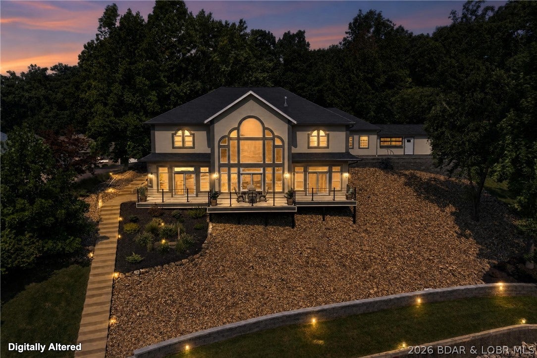 Designed for lake days & effortless entertaining - this beautifully remodeled Sunrise Beach home delivers 153' of lakefront, a private pool & an impressive 48x50 Trico dock at the 26 MM. Fully furnished with 5BR/3.5BA & 3,263 sqft the home was extensively updated in 2025 w/new flooring, paint, lighting, bathrooms, appliances & custom finishes throughout. The remodeled kitchen features raw-edge granite, Bosch drawer microwave, double oven & oversized refrigerator/freezer. A standout primary suite offers a copper soaking tub, brick-tile shower, copper sinks & custom lighting. Outside, enjoy the New 9x20 fiberglass pool, stamped concrete & turf surround, pool house w/bar & glass roll-up door, hot tub, fire pit & new deck. The dock is ready for serious lake time with a 14x44 cruiser slip, 10x24 slip, 2 PWC slips/lifts, swim platform, high dive, electric, water & ship-to-shore power. Add a heated/cooled 3-car garage w/workshop space, gentle .65-acre lot & protected cove location, & you have a Lake Home worth experiencing in person - Call for Private Showing!