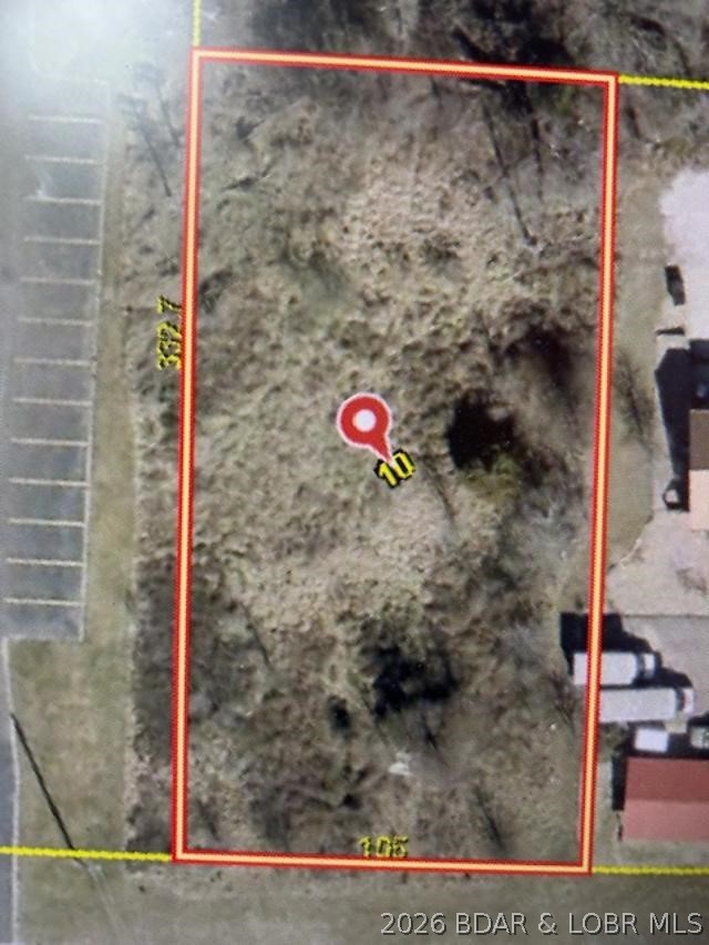 Level Lot on Hwy 5 in Laurie MO. Great for commercial development, very flat to gentle terrain. Outstanding location just South of the Laurie Bank (BANK OF VERSAILLES).  Take a look,  make the offer, one of the last level lots along HWY 5 in Laurie. City water and sewer are available.