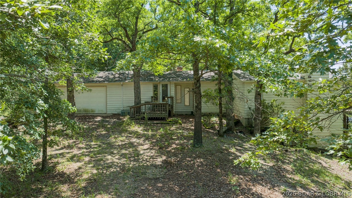 Investor Special with Lakefront & Development Potential! These views are some of the best at Lake of the Ozarks!

Opportunity awaits in Sunrise Beach! This property features a home in need of a complete renovation situated on approximately 3± acres with stunning lake frontage , plus two additional parcels totaling approximately 70± acres. The house is a true fixer-upper and is being sold strictly as-is, making it an ideal project for investors, builders, flippers, or buyers looking to create value.

Beyond the home, the acreage offers endless possibilities for development, recreation, hunting, private estate use, or future investment. Located just minutes from Bear Bottom Resort and the Lake of the Ozarks, the property provides convenient access to boating, waterfront dining, entertainment, and one of Missouri's most sought-after lake destinations.

Properties offering this combination of stunning lake views, substantial acreage, and investment upside are becoming increasingly difficult to find. Bring your vision, your contractor, and your imagination—this is a rare chance to transform a property with tremendous potential in a prime Lake of the Ozarks location.