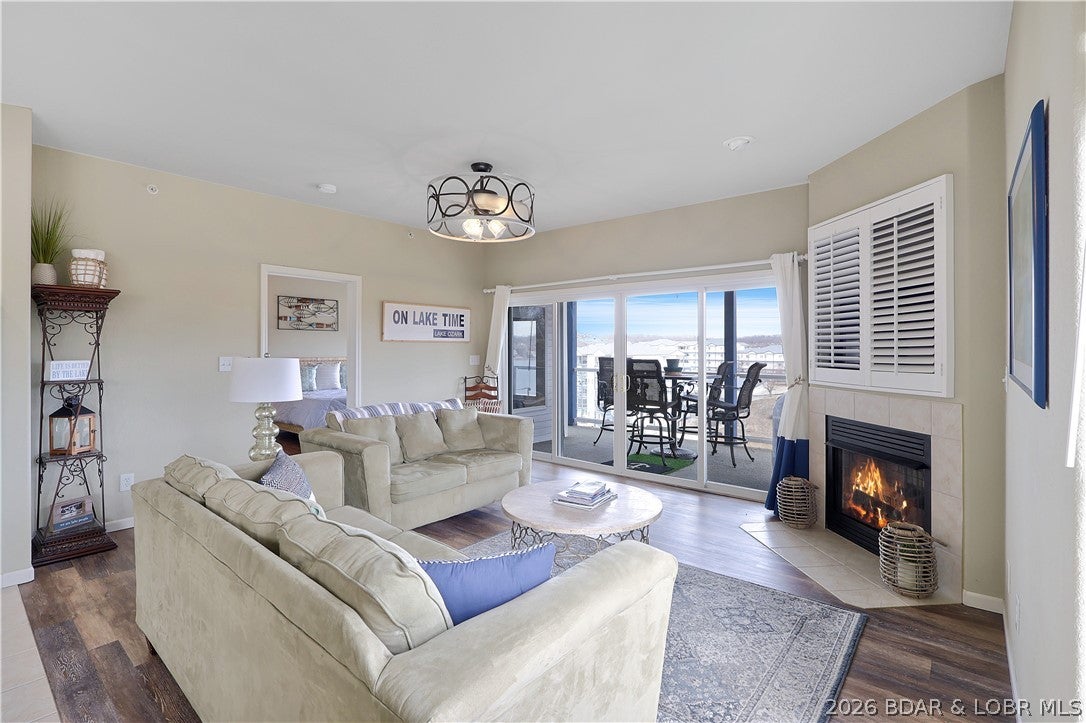 A 12x36 slip, proximity to The Strip, and beautifully renovated bathrooms—what else could you need? This top-floor, end-unit at Monarch Cove checks all the boxes and is ready to be your next lake escape, full-time residence, or income-producing rental. Thoughtfully maintained with longevity in mind, this condo features a newer HVAC system, new flooring, and two beautifully remodeled bathrooms with stylish, modern finishes. The top-floor location offers added privacy and peace and quiet, while the end-unit layout means fewer shared walls and plenty of natural light. Whether you’re looking for a part-time retreat, a place to park some money at the lake, or a turnkey nightly rental, this one offers plenty of flexibility! Monarch Cove is a well-maintained complex with beautifully kept grounds and three gorgeous lakefront pools, giving you all the perks of lake living without the hassle of maintaining a property yourself. Bring your boat, bring your friends, and slow down a little. This is what Lake of the Ozarks living is supposed to feel like.