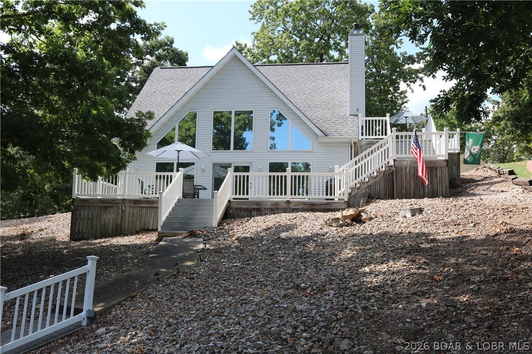MINT CONDITION TURNKEY HIGHLY DESIRABLE LAKE FRONT HOME. YOU WILL LOVE THE OPEN FLOOR PLAN WITH VAULTED CEILINGS AND PLENTY OF GLASS TO ENJOY THE VIEW, ENJOY OUTDOOR ENTERTAINING AND THE BEAUTIFUL PEACEFUL QUIET COVE SETTING ON THE EXTRA LARGE COMPOSITE DECKED SPACE. HOME IS VERY CLEAN AND NEAT WITH 3 LARGE BEDROOMS AND 2 BATHROOMS WITH ALL MAIN LEVEL LIVING ON THE LOWER LEVEL. OVERSIZED  2 CAR DETACHED GARAGE WITH 34 FOOT AND 30 FOOT BAYS BOTH WITH OPENERS. THIS IS A LOW MAINTENANCE PROPERTY WITH  EXPANSIVE PARKING AND PERFECT CLOSE TO TOWN LOCATION