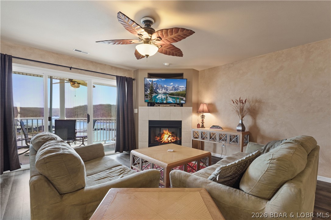 Enjoy stunning lake views and a front-row seat to the Lake Shootout from this fully furnished, turn-key 2-bedroom, 2-bath condo in the heart of Osage Beach. Overlooking the Lake of the Ozarks State Park, this well-maintained unit offers peaceful year-round views with an unbeatable vantage point during Shootout weekend. The open floor plan is designed for comfortable living and easy entertaining, while stylish furnishings allow you to move right in or begin renting immediately. Nightly rentals are permitted, making this an excellent vacation home or investment opportunity. The HVAC was replaced just two years ago, providing added value and peace of mind. A 12x30 boat slip with lift is included, giving you convenient access to some of the lake's best boating. Located just minutes from shopping, restaurants, golf, and popular waterfront destinations, this condo offers the ideal combination of lake lifestyle, convenience, and rental potential.