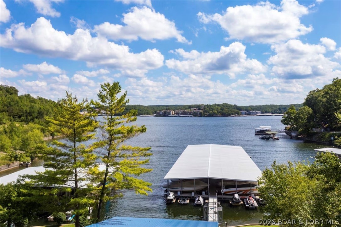 Welcome to this beautifully updated 1-bedroom lakefront end-unit with private boat slip 10 X 28 in the heart of Osage Beach—where convenience, comfort, and lake life come together. Just minutes from shopping, restaurants, marinas, grocery stores, the new Oasis, and the hospital, this is the perfect spot to enjoy everything Lake of the Ozarks has to offer.

This desirable end unit offers added privacy, extra windows for abundant natural light, and only 4 easy steps to the front door. Sold furnished and move-in ready, the condo features updated appliances, Granite countertops, refreshed finishes.

Step outside to your large shaded covered deck and take in the sparkling lake views while boats cruise by. A private storage room off the deck is perfect for storing lake toys and owner items.

Nightly rentals are allowed, creating excellent income potential. Located close to the exciting new Oasis entertainment district, this condo is ideally positioned for future growth and strong vacation demand. Pets are allowed for both owners and renters, making it even more attractive.

Whether you’re looking for a lake getaway, full-time retreat, or investment gem—this one shines!