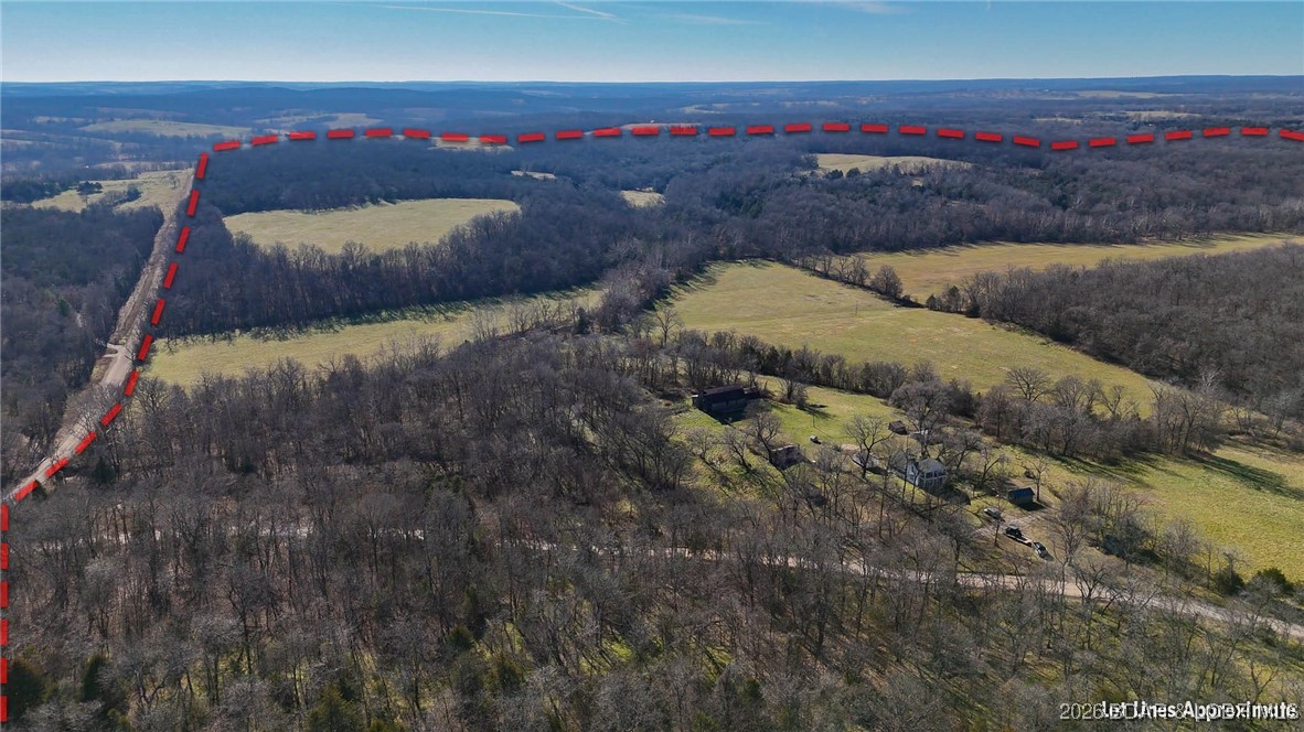 Step into quiet beauty of the Missouri countryside with this 308-acre property, ideally located just 30 minutes from the Lake of the Ozarks. Offering a rare blend of productivity, water, & recreation, this land is well suited for agriculture, hunting, or a private homestead. Over 80+ acres of open pasture currently produces more than 180 round bales of hay annually, providing a strong foundation for a cow-calf operation/hay production. This property is exceptionally well-watered, featuring a year-round pond & a substantial wet-weather creek, supporting livestock & attracting abundant wildlife. The remaining acreage offers timber, cover, & seclusion, creating excellent hunting opportunities & a peaceful rural setting with long-term land value. A 100-year-old farmhouse and several older barns remain on the property, adding historical character & potential for restoration. The main barn is equipped with water & 220-volt electric service, offering functional value for future improvements. Whether you’re looking to expand an ag operation, or invest in a large tract of Missouri land near the Lake of the Ozarks, this property offers space, resources, & the opportunity to make it your own.