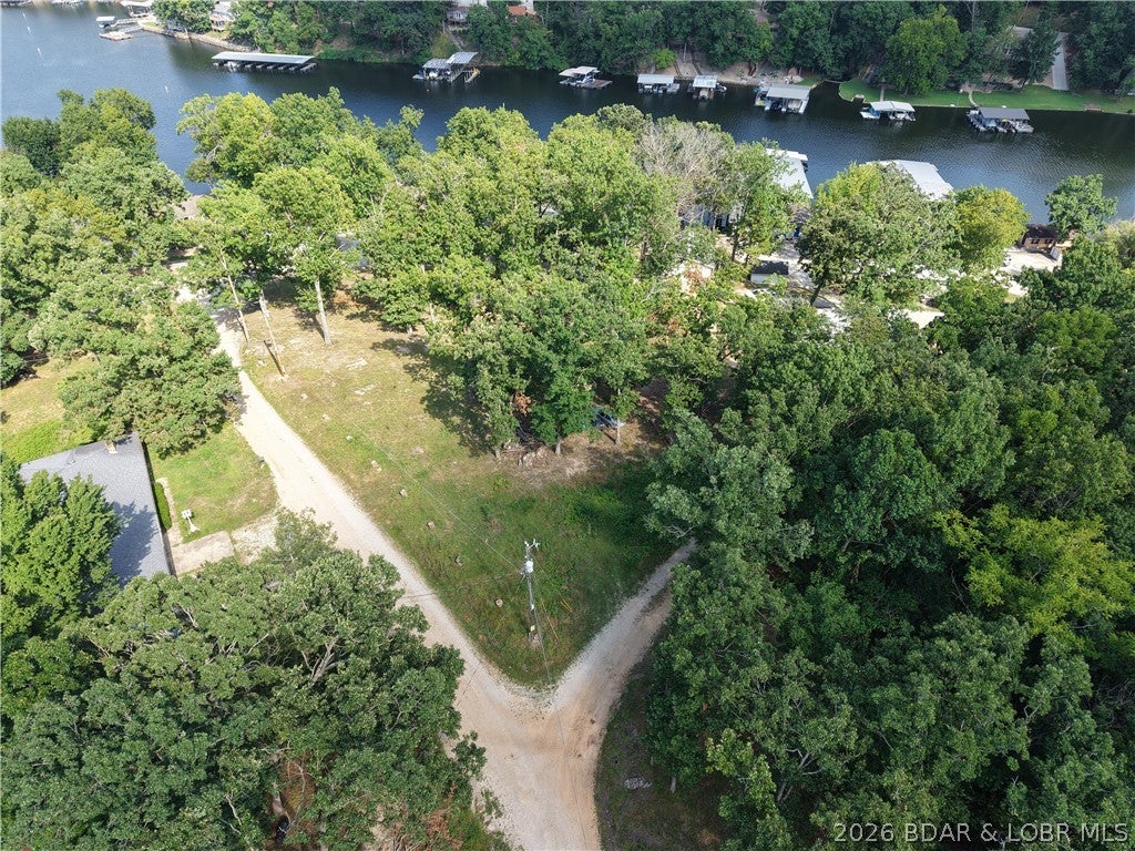 Your Lake of the Ozarks getaway starts here! This 0.79-acre second-tier lot offers the space and flexibility to create your ideal lake retreat. Located in Cape Hollow Cove at the 8 Mile Marker, the property has no restrictions, giving you the freedom to make it your own. Whether you’re planning a weekend escape, vacation spot, or a place to spend your summers at the lake, this property offers plenty of possibilities. Electric is already available, giving you a head start on your plans. Enjoy added convenience with access to community boat storage and a lake easement with boat ramp, making it easy to keep your boat nearby and get on the water. With nearly an acre, no restrictions, electric available, boat storage, and lake access, this property is ready for your vision. Bring your plans, lake toys, and start making memories at Lake of the Ozarks!