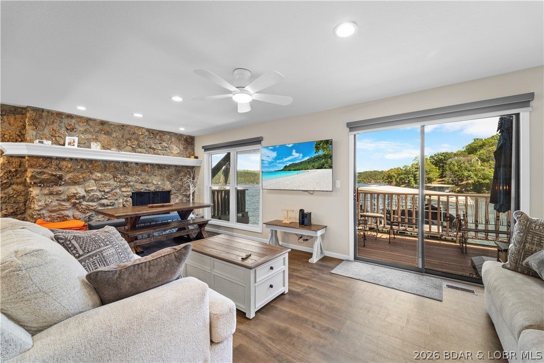 This beautifully renovated 2 -level, 2-bedroom, 2-bath condo offers modern comfort, thoughtful upgrades, and premium finishes throughout. Move-in ready, it’s ideal for full-time living or a lakeside getaway. Included is a12x32 boat slip in the new rough water dock for easy lake access. Inside, the unit was gutted and rebuilt with new drywall, and double-hung insulated windows with e-glass fill the space with light while improving efficiency. Major systems were replaced, including electrical panel and wiring, furnace and heat pump w/Ecobee thermostat, hot water heater, and large-capacity washer and dryer. The remodeled kitchen features custom soft-close cabinetry, new countertops, farmhouse sink, Bosch dishwasher, oven, built-in microwave, and refrigerator. A custom dining table adds a handcrafted touch. Both bathrooms were fully remodeled, and new LVP flooring offers durability and a sleek, modern look. The condo is fully furnished with all new pieces. Entertainment is easy with mounted flat-screen TVs in the living room and bedrooms, plus motorized window shades for effortless light control and privacy. Make this turnkey retreat yours and schedule a showing today!