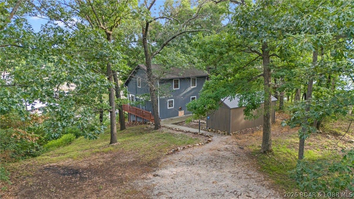 Lake life is calling! Wake up to beautiful lake views and enjoy the comfort of this beautifully remodeled 3-bedroom, 2-bath home designed for easy living and making lasting memories. Thoughtfully updated in 2020, the home features fresh, modern finishes while maintaining a warm and inviting atmosphere that makes you feel right at home. Start your mornings with coffee on the spacious porch, unwind in the evenings as the sun sets over the water, and enjoy the peaceful surroundings this property has to offer. Tucked away for added privacy, this home provides a relaxing retreat while still keeping you conveniently close to everything you need. There’s plenty of space for all your lake gear, too, with basement storage plus an outdoor storage shed ideal for fishing equipment, paddleboards, tools, and seasonal items.Whether you're looking for a full-time residence, a weekend lake getaway, or an investment property, this home offers plenty of possibilities. With its desirable setting and flexible use, it could be an excellent option for a short-term vacation rental or long-term investment.Just bring your bags, settle in, and start enjoying the lake life!