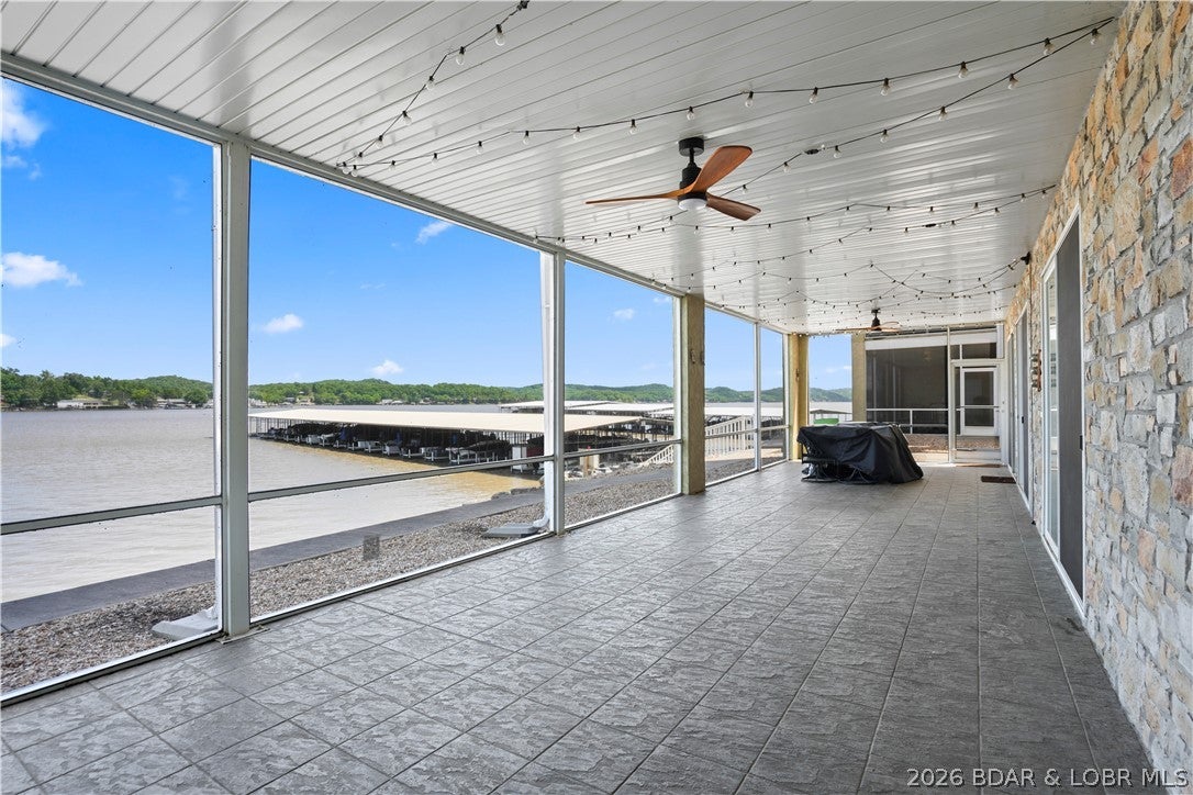 Wake up to breathtaking main channel views at the 34 Mile Marker in this spacious 4-bedroom waterfront condo. Designed for comfort and convenience, this unit features elevator access, making coming and going from your designated front row parking space to either the lakefront community pool, the community dock, or your condo effortless. The highlight? Open concept with kitchen, dining, and living room on one wing and the 2 full master bedrooms and 2 guest bedrooms on the other wing.  The favorite is always the huge screened-in deck overlooking the water which is the perfect spot to relax, entertain, and take in those incredible lake views year-round.  Just steps away, you’ll find your 12x32 boat slip, making lake days as easy as they should be.  Whether you’re looking for a full-time residence or the perfect lake getaway, this condo offers the ideal combination of space, accessibility, and unbeatable waterfront living.  To top it off this complex has a clubhouse with a gym, pool table, full kitchen and incredible views!  Don't forget to check out the community pool which is right on the waters edge with stunning views.