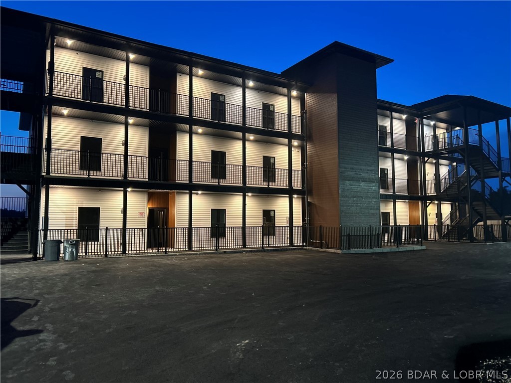 Welcome to the newest building at Robin’s at the Water’s Edge—one of the premier communities at Lake of the Ozarks. Only 8 units remain, offering a rare opportunity to own in this highly sought-after development. These brand-new 3BR/3BA condos (all en-suites) feature open-concept living with upgraded flooring, granite or quartz tops, and 8’ sliders leading to spacious covered decks with stunning main channel views. The lakeside primary suite includes a tiled walk-in shower and double vanity. Located at the 1MM of the Grand Glaize Arm, enjoy the perfect blend of big water views and gentle lakefront access. This prime Osage Beach location places you just minutes from top dining, shopping, and the State Park. Amenities include two pools, enclosed fishing dock, private boat ramp, elevator access, and community docks with slips available. Ideal for full-time living, a weekend retreat, or investment. Photos from model unit.