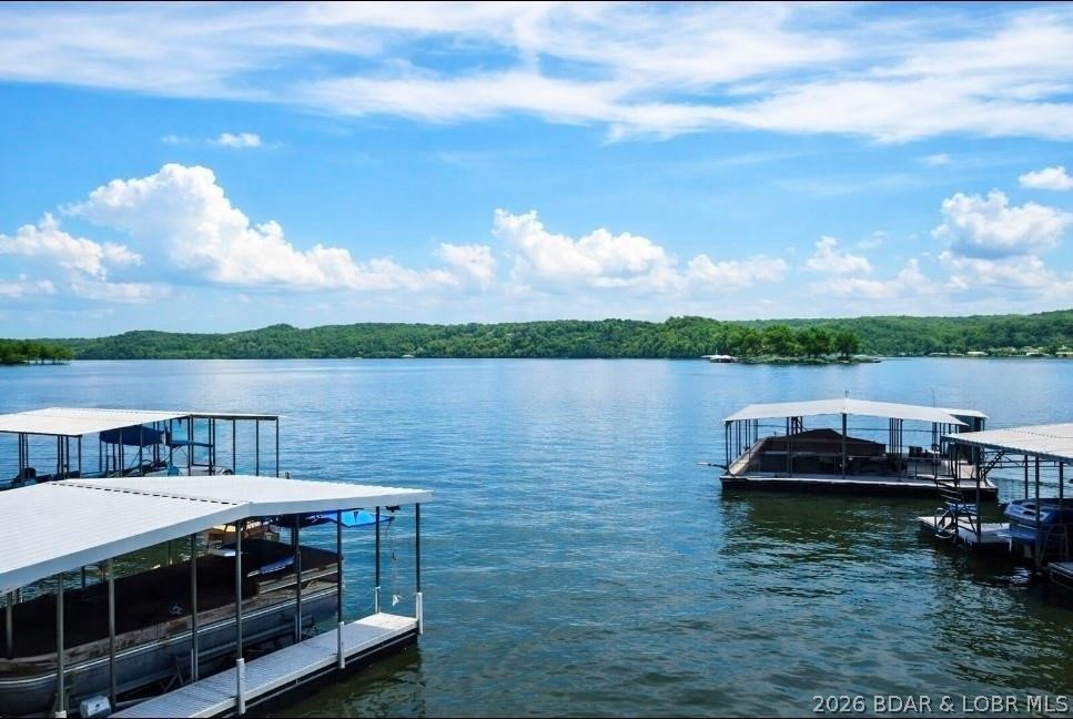 LAKE SEASON IS HERE ~ and this is the waterfront retreat you've been waiting for.

Seller is motivated and ready to make a move!
50MM of Lake of the Ozarks, this fully furnished waterfront home offers over 3,400 sqft, 4 bed, 2 full bath, & a private dock with electricity included. Whether you're looking for a full-time residence, weekend getaway, or investment opportunity, this property delivers the space, flexibility, and lake lifestyle buyers are searching for.

Designed for gathering, entertaining, and making memories. There's plenty of room for everyone to enjoy long weekends on the water. Spend your days boating, fishing, swimming, or simply soaking in the lake views from the deck. With furnishings included, you can start enjoying the lake from day one.

The generous floor plan comfortably accommodates large groups, making it an attractive option for personal use or potential short-term rental income. A newer roof, private well, and dock access add to the appeal and value.

Summer is in full swing. The lake is calling. Don't miss your opportunity to own a turnkey waterfront property at Lake of the Ozarks.

Seller is motivated. Schedule your private showing today.