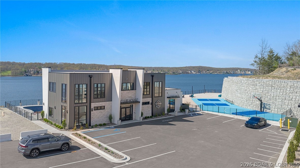 The Toy Box is located at the Lake of the Ozarks most recognized intersection at Horseshoe Bend and Bagnell Dam Blvd. in Lake Ozark, Missouri. With a 180 degree Panoramic View of Lake of the Ozarks, these Lux Loft units are like nothing else in the area. This unit is (25’ x 60’ with 23’ side walls and a mezzanine) for Residential use only. The development will be governed by a Condo Owner Association and offers a pool, clubhouse with full indoor kitchen, innovative gym, pickle-ball court, basketball court, A boat wash area and RV pump out allow you to work and play within your own community. An observation deck overlooking miles of Lake of the Ozarks shoreline truly set this property apart from all others, while giving you the peace of mind of a gated community! All of this just a minute drive from the buzzing Bagnell Dam Strip. Come be a part of the Lake of the Ozarks where We Have a Lifestyle For You!