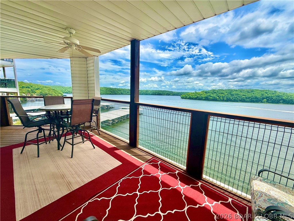 Experience lake life at its finest in this stunning condo offering breathtaking views of the lake and surrounding state park from your own PRIVATE PATIO. Start your mornings with a cup of coffee, or spend evenings entertaining friends and family with gatherings overlooking the lake. Boating enthusiasts will love the included 12X30 SLIP and dock, providing easy water access to popular waterfront destinations like DOG DAYS, RED HEADS and BACKWATER JACKS. Outdoor lovers will also appreciate the abundance of nearby hiking trails to explore nature. Inside, the condo is just as impressive, featuring a spacious living area with incredible LAKE VIEWS that create the perfect backdrop for relaxing or entertaining. The kitchen offers a breakfast bar, great for gathering with guests and has PLENTY OF SEATING. During winter, watch the snow fall on the lake while warm next to the FIREPLACE. Retreat to the master suite and into the master bathroom and enjoy HIS AND HERS SINKS. Whether you’re searching for a full time residence, vacation getaway, or INVESTMENT OPPORTUNITY, this condo combines comfort and unbeatable scenery into one exceptional package. BONUS: New roof installed March of 2026!