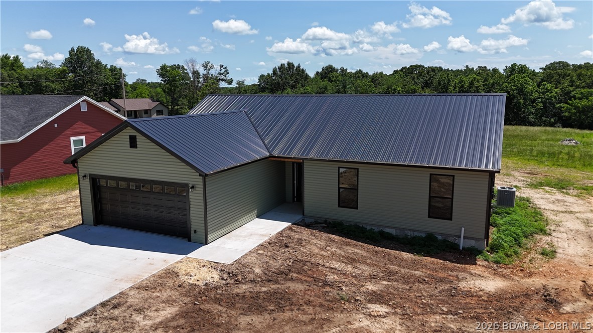 Construction is complete on this brand-new 3 bedroom, 2 bath home offering 1,540 sq ft of modern living space in Eldon, MO. Enjoy a fresh start with no previous owner surprises, no outdated finishes, and no “we can just live with it” design decisions. The open layout provides comfortable living for everyday routines, entertaining, or simply enjoying a clean slate home. The 2-car garage offers ample space for parking, storage, hobbies, and all those items you promise you will organize someday. Energy efficient construction with spray foam insulation helps keep utility costs manageable while maintaining year-round comfort. Conveniently located near schools, shopping, dining, and local employment opportunities, this home offers both comfort and accessibility. Construction is complete and the home is move-in ready, making it an excellent opportunity for buyers looking for brand-new construction without the wait.