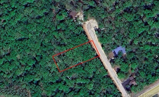 WHAT A DEAL!!!!! Four Season level lot is now available for you and JUST reduced, do you have your house plans yet? Gentle 210' deep lot just off of Horseshoe Bend and close to all the lake happenings plus you have all the Four Seasons Amenities. Also located in a cul-de-sac with privacy and nice timber on blacktop. Amenities such as community pools, walking/biking trails, tennis courts, campground, dog park, exercise/workout perks, interior lake, playgrounds, boat ramp and more.