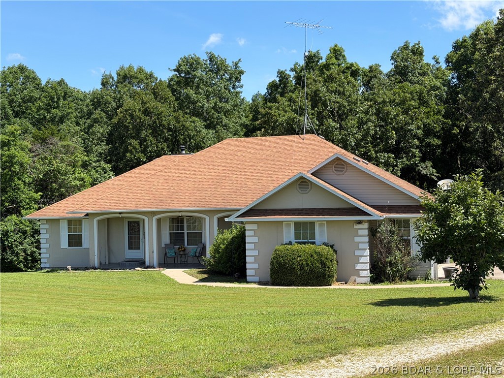 Discover the space and serenity of 16 acres with convenient Highway 52 frontage and endless possibilities, this beautiful ranch home offers the perfect combination of privacy, space, and convenience. The home features 3 bedrooms, 3 full bathrooms, with big open living room and formal dining area, this home was designed for comfortable living and entertaining. The spacious living room boasts vaulted ceilings, abundant natural light, and a wood-burning stove, creating a warm and inviting atmosphere. Hardwood flooring flows through the dining area while the kitchen offers ample cabinetry and workspace. The master bedroom includes a large walk-in closet and an oversized master bathroom. Additional features include a utility room, generous storage throughout, and a partially finished basement offering potential for additional living space, recreation, or workshop use. Outside, a long gravel driveway leads to the home, which is surrounded by mature trees and open acreage suitable for a variety of uses. Whether you are looking for a hobby farm, hunting property, country retreat or simply room to spread out, this property offers endless possibilities. HOME SOLD AS IS