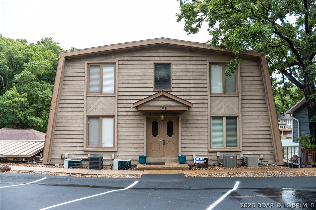 Experience easy, affordable lake living in the heart of Osage Beach with this turnkey 1-bed, 1-bath condo close to shopping, dining, entertainment & all the excitement of Lake of the Ozarks. Whether you’re searching for a weekend retreat or low-maintenance full-time residence, this condo offers the ideal blend of comfort & convenience. Located in a quiet 12-unit complex, this property provides a peaceful atmosphere while still keeping you close to everything Osage Beach has to offer. The heated swimming pool is just steps from the unit, making it easy to relax and enjoy sunny afternoons by the water. Even better, the included 10’x20’ boat slip with a 10’x22’ roof gives you quick access to the lake whenever adventure calls. Inside, you’ll appreciate thoughtful updates including a smart thermostat, reverse osmosis water system, newer microwave & convection range & an HVAC system replaced just two years ago. Step outside onto the brand-new composite deck replaced in 2025, creating the perfect place to unwind after a day on the lake. With affordable assessment fees & an unbeatable location, this move-in ready condo is your chance to enjoy the lake lifestyle without breaking the budget.