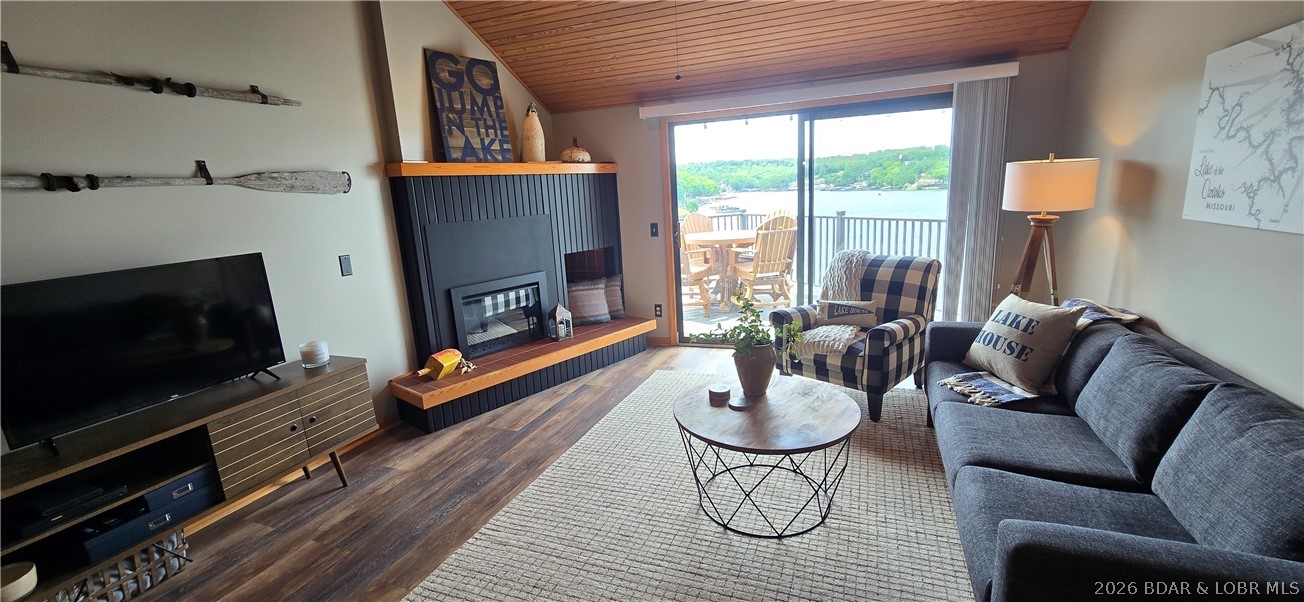 REDUCED! Updated top floor condo:10mm.Awesome lake views both up/down the main channel!2 bdrms AND vaulted loft area for a 3rd bdrm/living space.3 full bathrooms!Covered 14'x32' boat slip w/ lift!If boat hasn't already sold,it is available for extra $.Updated kitchen w/granite counters,breakfast bar seating for 4,newer tile backsplash,& stainless appliances!Closet pantry!Newer LVP flooring(no carpet)!2025 New composite deck w/metal railing & new front storm door w/pull down screen.Heavy Duty Deck Furniture Stays!2021 New Heatpump.Updated fireplace!Turn Key:most furnishings remain-see list in supplements.Primary bdrm & loft bdrm each w/private bath!Loft w/walk-in closet.HOA dues cover too much to list here... see full list in supplements but here are highlights:internet/tv,clubhouse,pool,hot tub,meeting area,sauna,workout room,hangout/pool table room,poker room,library,tennis/pickleball court,water,sewer,trash,exterior maintenance,landscaping,pest control,management,on-site full time maintenance for the HOA,& your own storage unit in the lower level of building.Only 1.5 stories up from the parking level.Designated parking space in front of the building.6+ plus month rentals allowed.