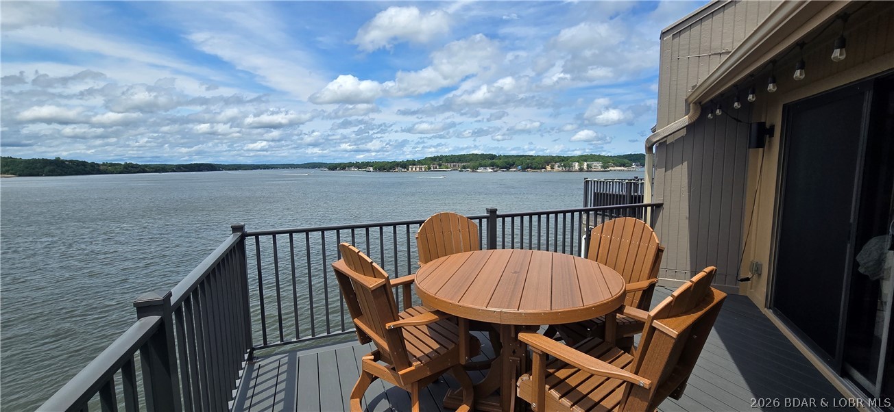 Updated top floor condo:10mm w/awesome lake views both up & down the main channel!2 bdrms AND vaulted loft area for a 3rd bdrm/living space.3 full bathrooms!Covered 14'x32' boat slip with lift!If boat hasn't already sold,it is available for extra $.Updated kitchen w/granite counters,breakfast bar seating for 4,newer tile backsplash,& stainless appliances!Closet pantry!Newer LVP flooring(no carpet)!2025 New composite deck w/metal railing & new front storm door w/pull down screen.Heavy Duty Deck Furniture Stays!2021 New Heatpump.Updated fireplace!Turn Key:most furnishings remain-see list in supplements.Primary bdrm & loft bdrm each w/private bath!Loft w/walk-in closet.HOA dues cover too much to list here... see full list in supplements but here are highlights:internet/tv,clubhouse,pool,hot tub,meeting area,sauna,workout room,hangout/pool table room,poker room,library,tennis/pickleball court,water,sewer,trash,exterior maintenance,landscaping,pest control,management,on-site full time maintenance for the HOA,& your own storage unit in the lower level of building.Only 1.5 stories up from the parking level.Designated parking space in front of the building.6+ plus month rentals allowed.