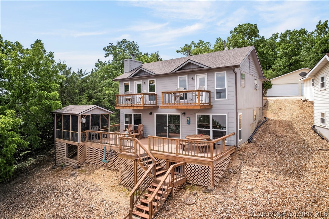Discover the quieter side of the Lake of the Ozarks! Situated at the 60 mile marker, this beautiful 3-bedroom, 2.5-bathroom lake home offers 1,697 sq. ft. of comfortable, relaxed living space designed for hosting family and friends. Inside, you'll find an inviting, open layout with great lake views —the perfect setup for effortless weekend getaways or full-time lake living. Step outside to a fantastic deck space where you can drink your morning coffee or entertain after a day on the water. The calmer water on this stretch of the lake offers incredible fishing, smoother boating, and true lake serenity. The house comes Fully Furnished and ready to enjoy.
This property includes a massive, separate 30x30 detached garage with a poured concrete floor and full electrical—perfect for storing your boat, lake toys, or setting up the ultimate workshop. Schedule your showing today and start living the lake life! the house comes. The Boat is available for purchase separately.