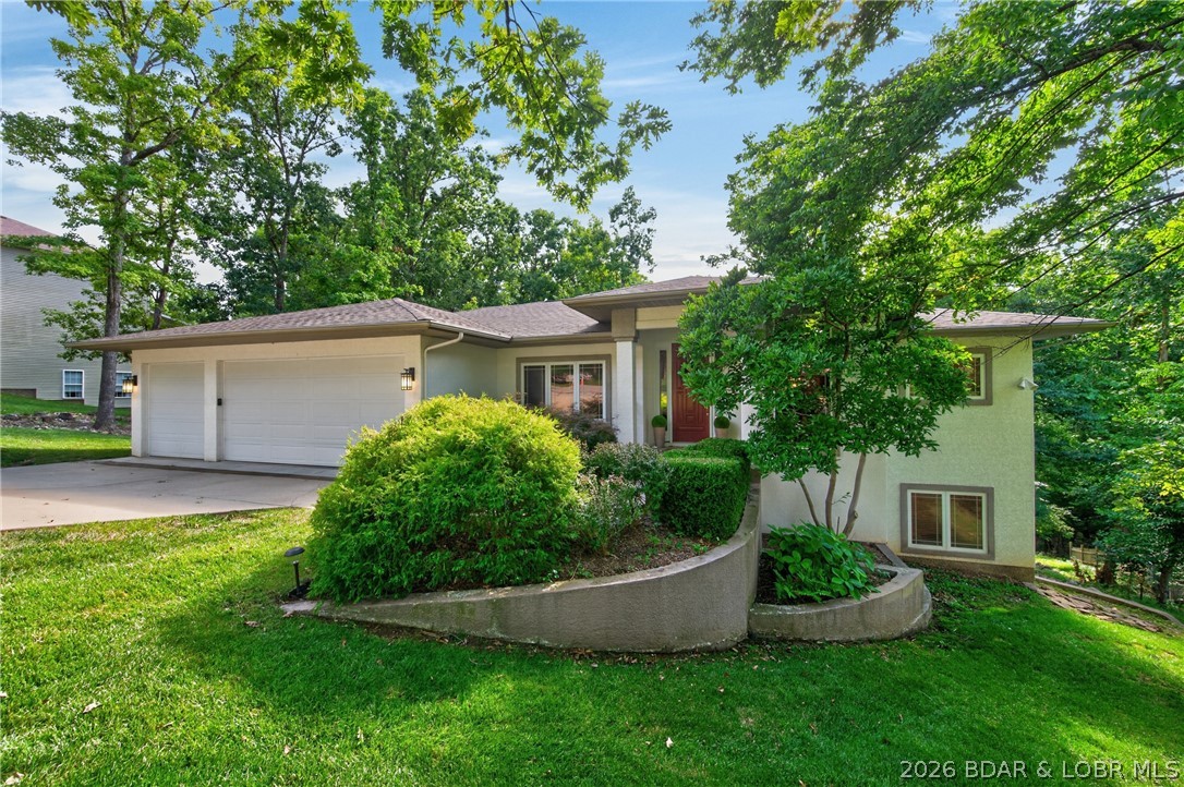 Surrounded by mature trees this 5+ bedroom home is a standout in an established neighborhood. Soaring ceilings, large sunlit rooms and a beautiful, curved stairwell accenting the entry. Main level living with recently remodeled kitchen, inviting as well as functional, quartz counter tops, pantry and bar seating. Main level Livingroom with floor to ceiling windows, vaulted ceiling w/ accent lighting, dining area and screened porch. Executive suite is spacious with adjoining bath, double vanities, soaking tub and walk in shower. Two walk-in closets with custom built-ins will give your friends closet envy. Halfbath and office-guest room complete one level living.3 car garage enters into laundry with good drop-off area. Curved stairwell leads the lower level family room with high ceilings and large windows with deck access. A second full suite is one of three bedrooms. Two additional non-conforming bedrooms rooms add additional options.. Large closets thru-out and unfinished storage areas add abundant storage. Additional 550 sq ft  finished room w half bath accessed by a separate exterior entrance offers space for a private office, gym or playroom. Four Seasons amenities. Central sewer