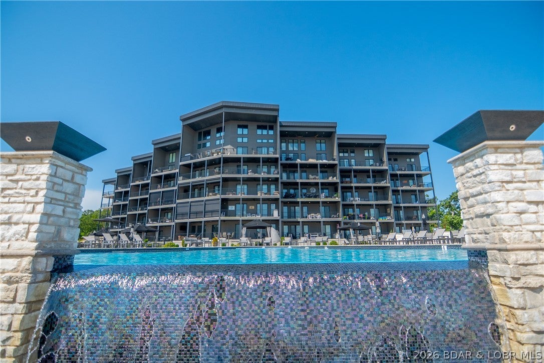 Top floor, end unit, 14x40 boat slip, 2 pwc spots AND a garage—this is the Havens condo you've been waiting for! Located in one of Lake of the Ozarks' premier condominium communities, this beautiful 3-br, 3-bath residence combines incredible views, upscale finishes & a hard-to-beat package. The coveted top-floor end-unit location means no neighbors above, soaring vaulted ceilings & additional windows that flood the condo with natural light while showcasing the views. The open floorplan is perfect for entertaining with a spacious kitchen featuring granite tops, large dining area and comfortable great room flowing to the lakeside deck. The primary suite enjoys the view plus a private bath with double vanity, tiled walk-in shower & custom closet. A second ensuite, third bedroom and full bath provide plenty of room for family and guests. Sold beautifully furnished & complete with a 14x40 cove-protected boat slip AND nearby garage! The Havens is a smaller, intimate complex offering elevators, no-step access, beautiful pool/grounds, while still allowing rentals. Conveniently located near dining, golf & entertainment. Great view, great slip, garage, furnishings & an exceptional location!