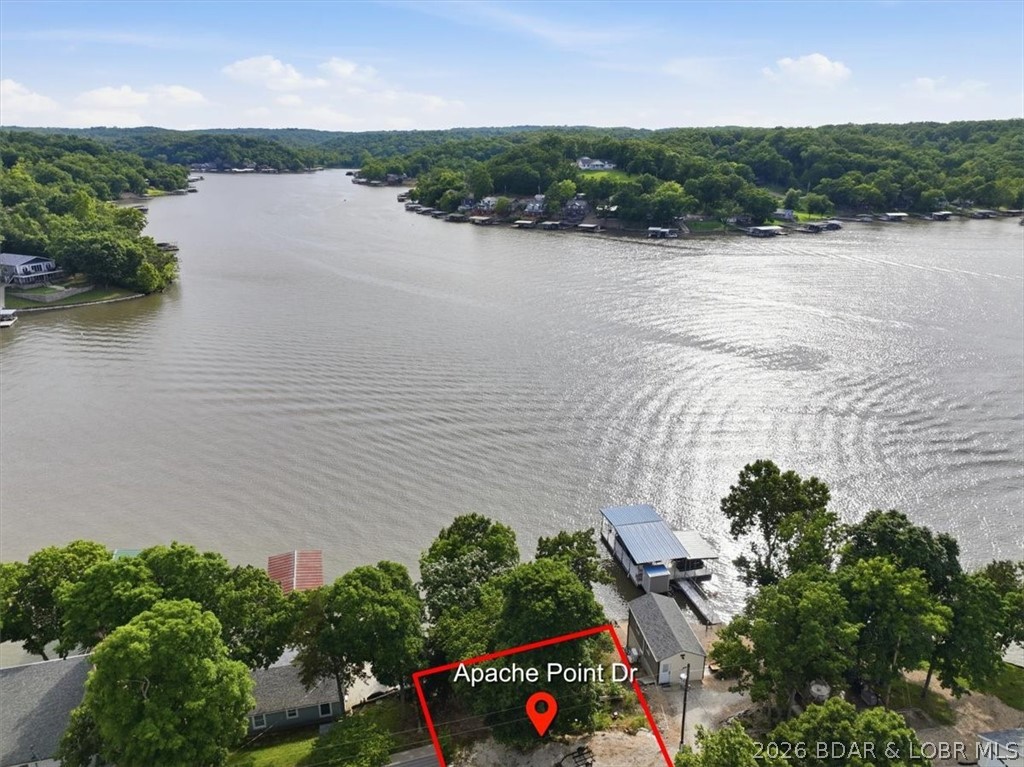 ARE THE LEVEL LAKE LOTS ALL GONE? NOPE! Rare opportunity to own an affordable lakefront lot in Apache Point Subdivision at Lake of the Ozarks. This waterfront parcel offers the chance to build the kind of lake place families dream about — a place where mornings start with coffee by the water, afternoons are spent out on the boat, and evenings end around a fire with family and friends. Located in Climax Springs just off Hwy 7, down Bollinger Creek Rd. at the 50 mile marker! This property offers a peaceful setting while still being close to all the lake fun, including boating, fishing, waterfront restaurants, and entertainment. Whether you’re looking to build a weekend getaway or a future full-time lake home, this property offers a great opportunity to create your own piece of the Lake of the Ozarks lifestyle. 
To help showcase the waterfront's potential, Atlas Docks has already completed a preliminary dock concept drawing. 
Please see the attached document for possible dock layouts and boat slip sizing options. Properties like this are getting harder to find — especially at this price point. Bring your lake house plans and start imagining the memories waiting to be made here.