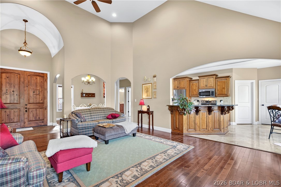 Tucked into the peaceful Deer Path Estates community, 132 Antler Point in Linn Creek offers comfortable one-level living with the space and setting to truly feel at home. This 4-bedroom, 3-bath brick home features vaulted ceilings, an open main living area, and a bright kitchen and dining space designed for everyday living and easy gathering. The private primary suite offers a relaxing retreat, while the spacious deck overlooks a beautiful wooded backdrop and gently sloping yard. With a 3-car attached garage, .24-acre lot, and convenient access to Hwy 54, this property combines privacy, practicality, and a welcoming feel in the Camdenton School District. New roof May 2026!