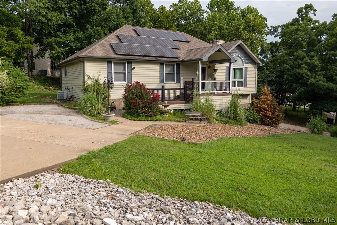 Some homes simply check the boxes. Others feel like home. Welcome to 11 Trevino Court in Country Club Estates, where neighbors become friends and lake living is meant to be enjoyed. Situated on a spacious corner lot, this home features vaulted ceilings, natural light, a cozy wood-burning fireplace, spacious kitchen with a butcher block island, farmhouse sink and stainless steel appliances. The walkout lower level offers 840 sq. ft. of living space with a spacious second family room, full bath, and a non-conforming room ideal as a fourth bedroom, home office, craft, or fitness area. The heated & cooled 660 sq. ft. oversized garage/workshop provides year-round comfort for vehicles, projects, lake toys, and storage. Over 400 sq. ft. of outdoor space across four decks, where deer, turkey, and wildlife are frequent visitors. Hop on your golf cart and enjoy easy access to championship golf courses, restaurants, and resort amenities. Village of Four Seasons amenities include pools, tennis courts, playgrounds, boat ramps and more. Whether you are looking for a full-time residence or the perfect weekend retreat, this home offers the best of Lake of the Ozarks living.