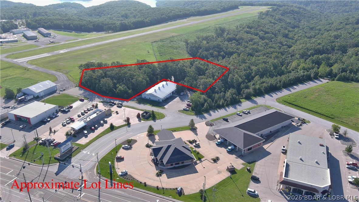 Excellent Opportunity to Own a Great piece of property with direct access at the stoplight off KK and Bus 54 in the heart of Osage Beach.  Easy access to the Bypass. Great visability to the Highway.  Property lays flat and offers access to City water & sewer. Ameren electric is available. This property sits next to the Osage Beach airport and well known established businesses.  Endless opportunities with many different types of business options to be built here.  Please see attached survey and call agents for details.  Note- taxes to be determined as a new parcel number is being assigned.