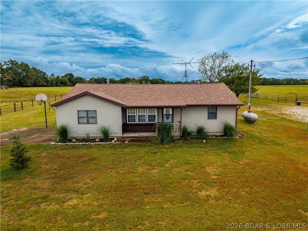 Looking for acreage, storage, and a property that’s ready to enjoy? Situated on 10 flat, usable acres, this property offers plenty of room for animals, hobbies, recreation, or simply enjoying the space and peaceful setting. The acreage is fully fenced with pre-stretched fencing and features two ponds, including one recently installed and another that is stocked. A beautiful 100-year-old barn adds character to the property and was re-braced in 2025, while the detached insulated shop provides additional space for storage, projects, or hobbies and has the ability to accommodate a stove. The home has seen numerous big-ticket improvements, including a new roof in 2025, new vinyl flooring, some new windows, all new screens, fresh paint throughout, updated bathrooms, new vinyl siding on two sides, a new microwave, and new water heater. Additional improvements include new landscaping designed for added privacy, and the septic system is only approximately three years old. With usable acreage, multiple outbuildings, ponds, fencing, and many of the major updates already completed, this property offers a little bit of everything!