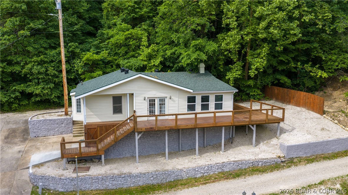 Discover the perfect blend of privacy, potential, and lake lifestyle with this unique property situated on nearly 3 peaceful acres with a private boat ramp & new dock just steps away. Major improvements have already been completed, giving buyers peace of mind and a strong head start on creating their ideal lake retreat. Recent upgrades include all NEW: HVAC; well pump; refurbished well house, updated & inspected electrical; sump pump; enlarged deck; sliding door to the side deck, septic tank w/laterals checked; and extensive exterior improvements throughout the property. Additional features include an oversized 2-car garage, shed, shooting range, abundant parking for boats and trailers & a quiet setting perfect for full-time living or weekend escapes. The interior has been dry-walled, painted and is ready for your finishing touches, allowing you to customize the home to your personal style & preferences. A contractor is available to complete the interior for approximately $25,000 in labor plus materials, or finish it yourself & build instant equity. Hard-to-find combination of acreage, privacy, lake access, & major updates already completed makes this property a rare opportunity!