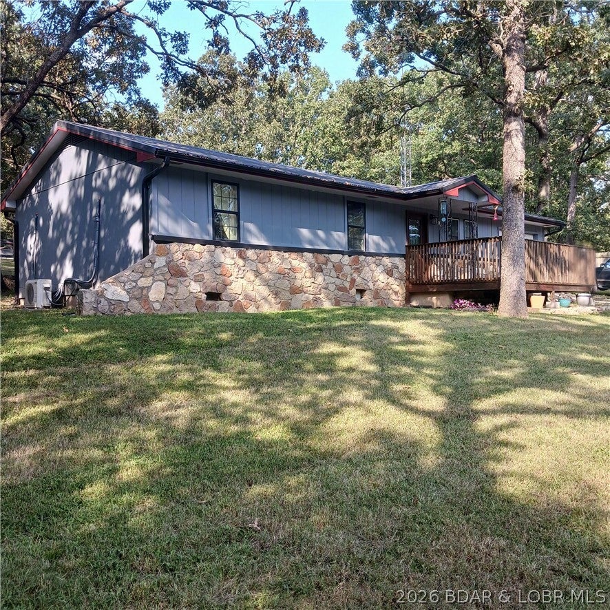This move-in-ready 3-bedroom, 1 & 1/2 bath ranch home on a quiet street in Versailles offers small-town country living at its best. Interior features include lock-together laminate flooring, kitchen appliances, custom ceilings, trendy light fixtures, newer cabinets & countertops. Plus! - you will stay cool in the summer and warm in the winter with remote climate-controlled mini-split heating and cooling units. The house has an attached garage, and a workshop with a double-door side entrance. The home's exterior features include attractive rock work, wooden siding, and a newer metal roof and guttering, Also featured is an attractive front-entrance deck that overlooks the large front yard. Other outdoor features include a private well and septic (with a visible hatch). Out back, you will find additional rock work, a patio outside the French doors leading from the dining area and plenty of space to build an additional garage, install a swimming pool or whatever you can imagine to make this property uniquely yours. The neighborhood projects serenity in a country atmosphere, but is only a short drive from town. Schedule your showing today and come see it for yourself!